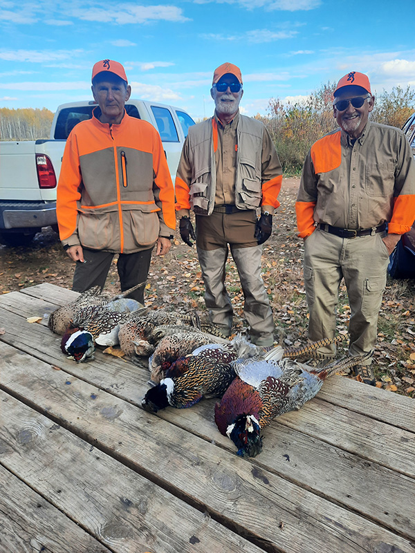 group-bird-hunters-with-pheasants-on-table group-bird-hunters-with-pheasants-on-table